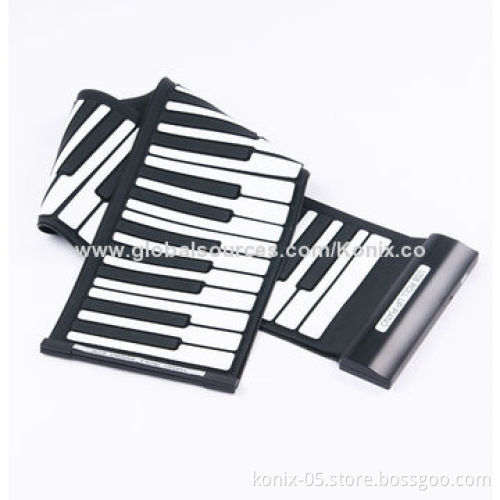 Some one play a folding roll up piano for learning
